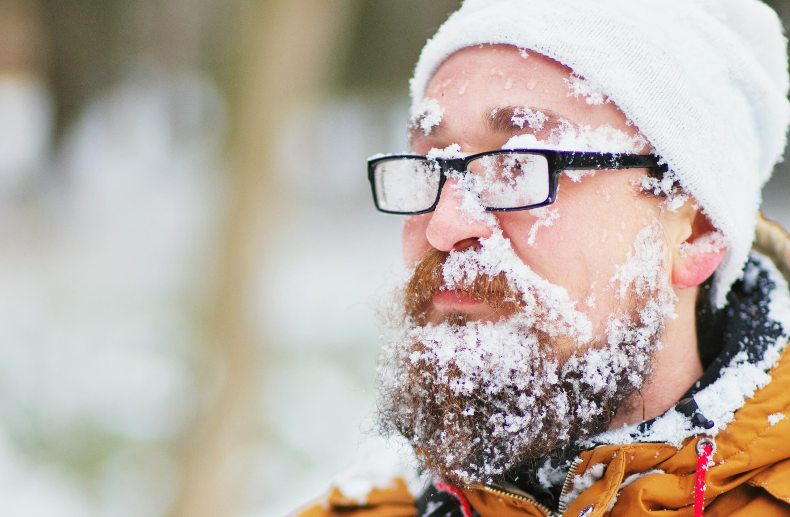 Bearded man with snow on his face