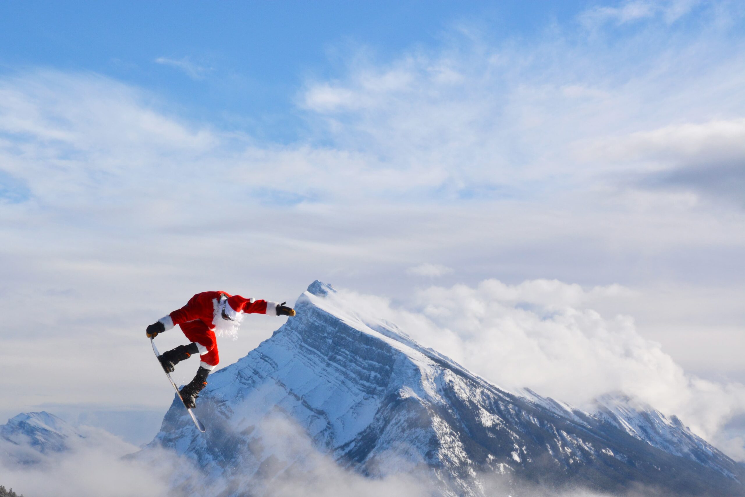 Santa Claus snowboarding