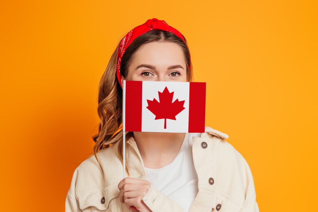 Woman holding up a Canadian flag