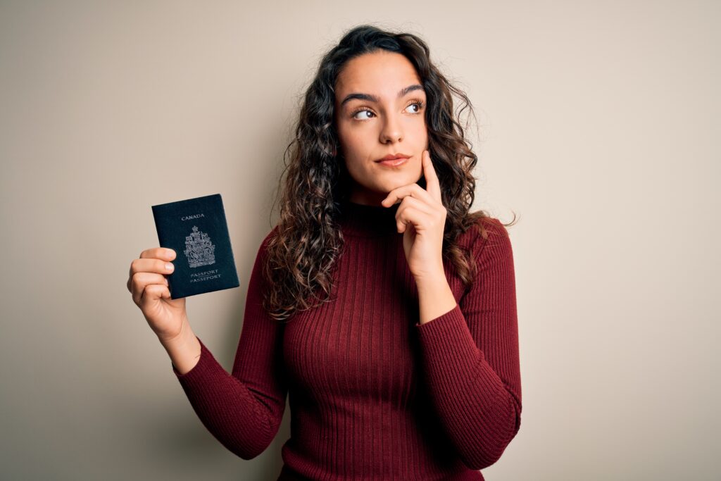 Girl with Canadian passport thinking