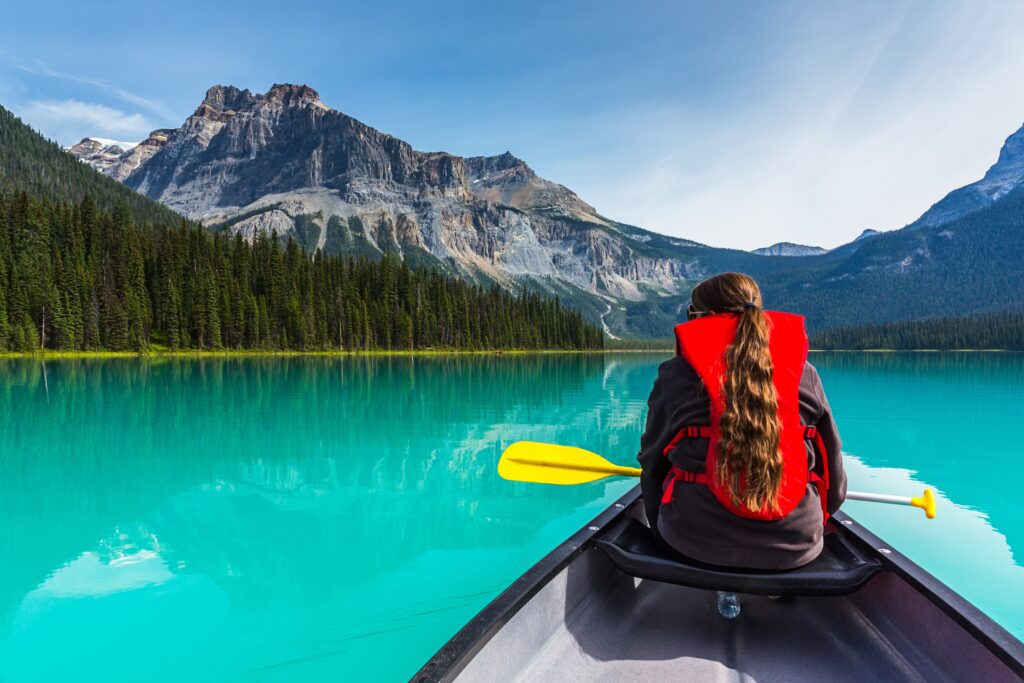 Girl canoeing at Yoho National Park Alberta Canada