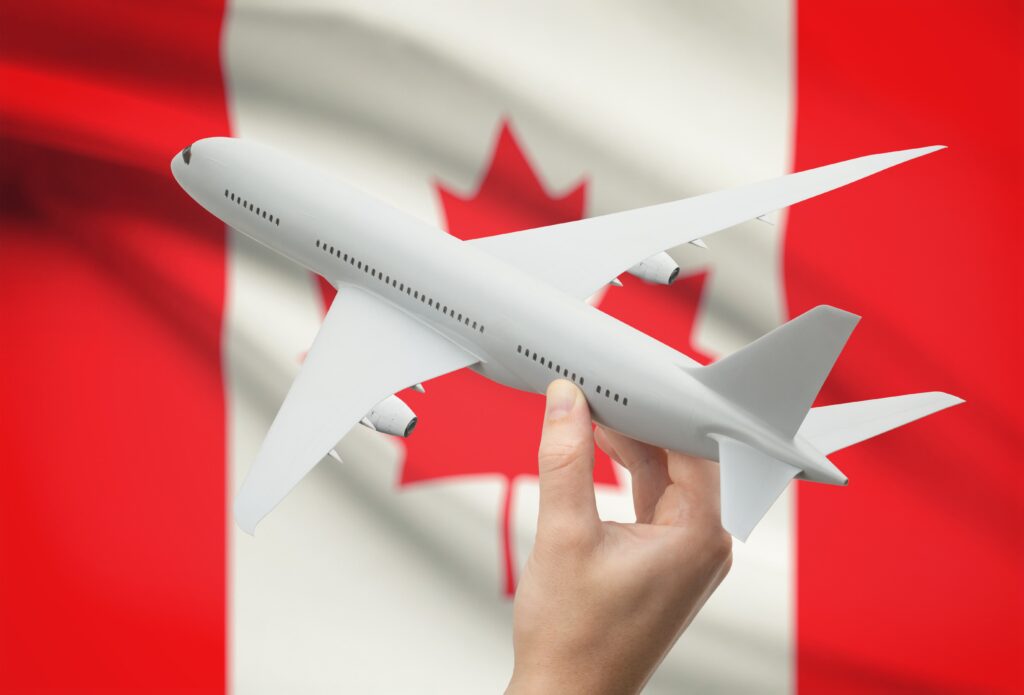 Plane on Canadian flag background