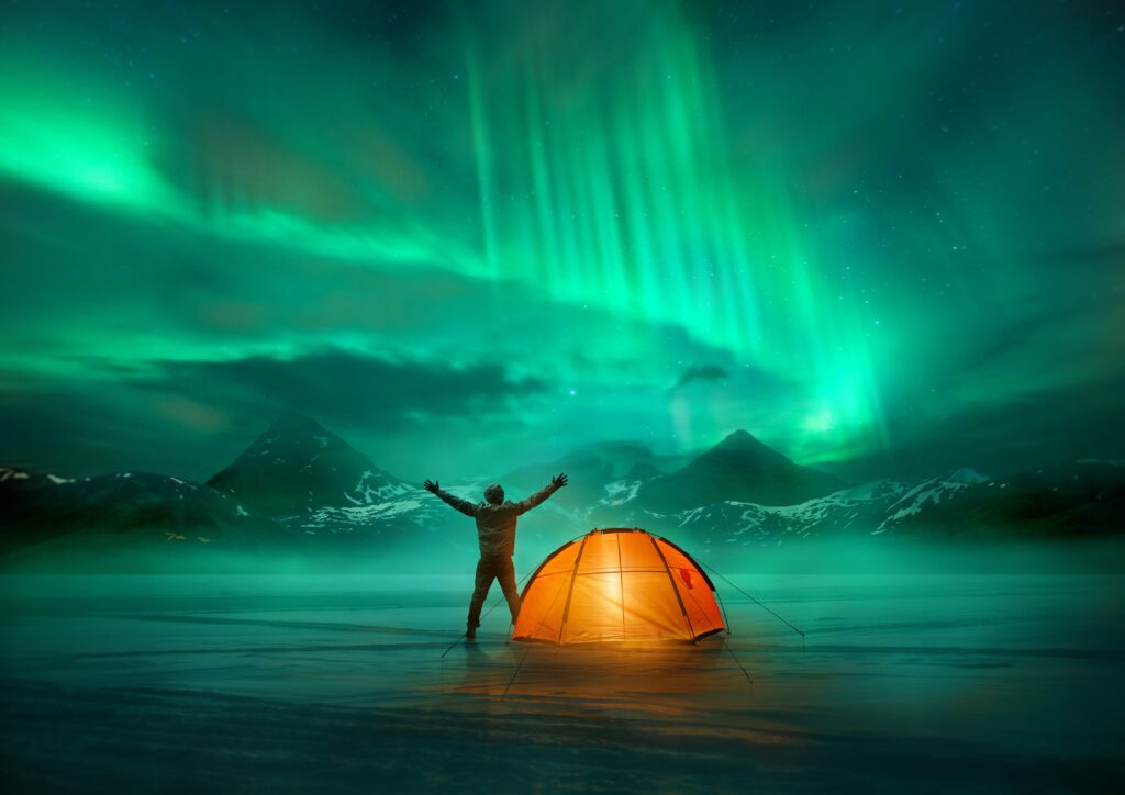 man watching the Canada Aurora Borealis