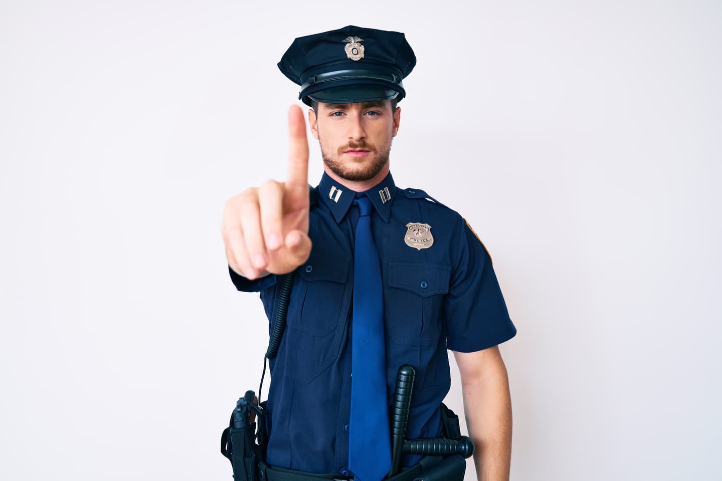 Police officer raising a finger