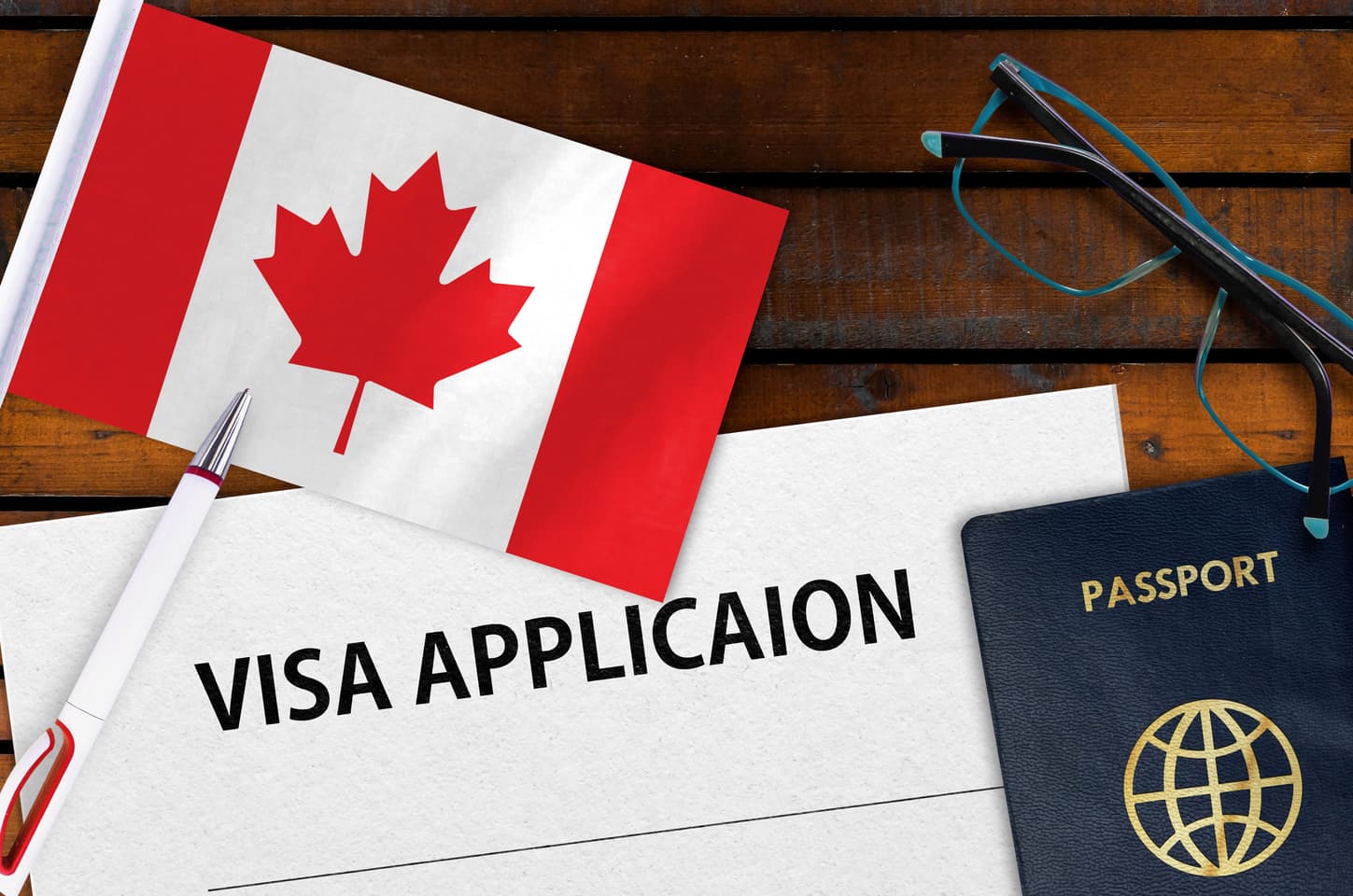 Canadian visa application with flag and passport