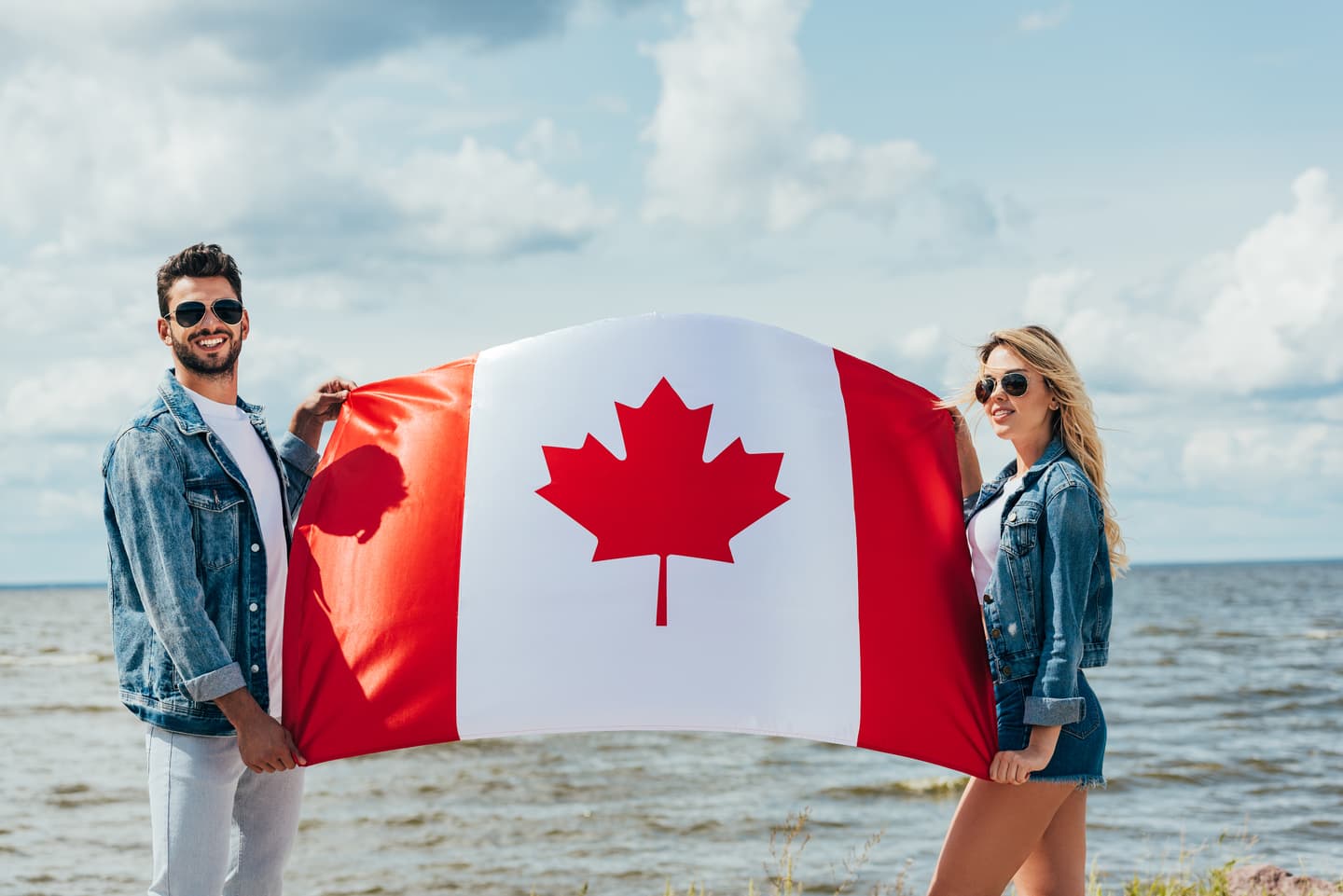 Couple holding a Canadian flag